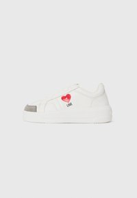 White sneakers with a smooth leather finish, featuring a red heart graphic and the word "LOVE," grey suede toe cap, and rubber sole.