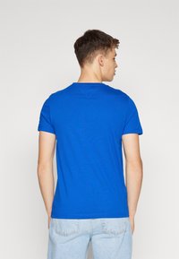 Tommy Hilfiger LOGO TEE - T-shirts med print - navy