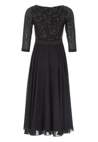 Robe noire avec un corsage en perles et sequins et des manches trois-quarts. Jupe fluide en tissu léger, cintrée à la taille.