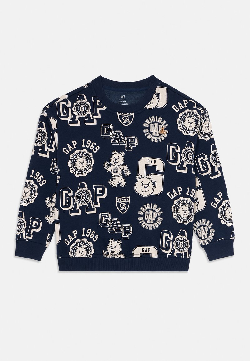 Felpa blu navy con logo beige GAP su tutta la superficie, distintivi vintage e illustrazioni di orsi cartoon, maniche lunghe, polsini e orlo a costine.