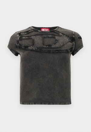 T-shirt noir à manches courtes avec un design texturé et des accents effilochés sur le devant. Confectionné en denim avec une coupe décontractée.