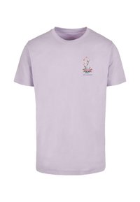 Light purple cotton t-shirt with a crew neck. Features a floral design and British flag with "Royal Explorers" text on the chest.