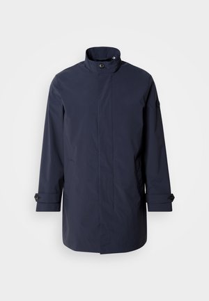 Navy waterproof jacket with a high collar, front button closure, side pockets, and adjustable cuffs. Smooth texture with a minimalist design.