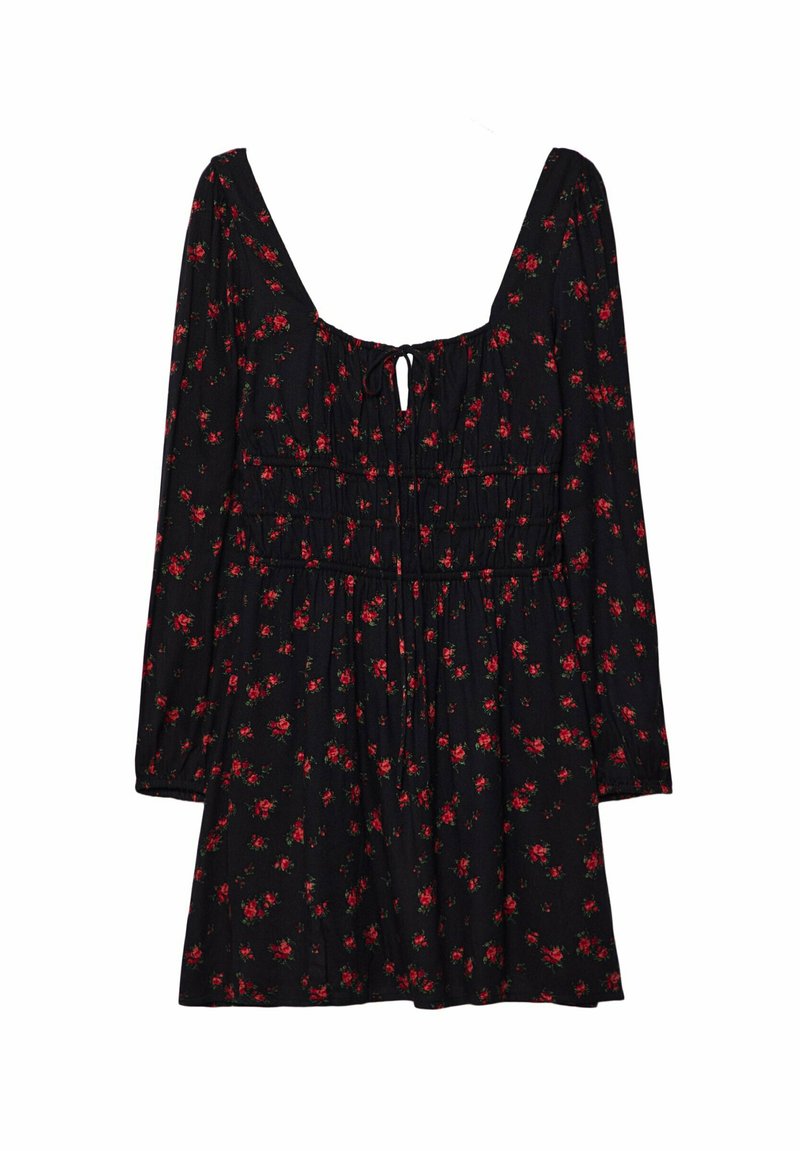 Schwarzes Kleid mit langen Ärmeln, quadratischem Ausschnitt, tailliertem Bund und floralem Muster in Rot und Grün. Mit einem Bindeband hinten.