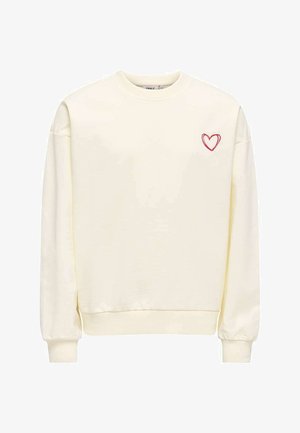 Sweat-shirt crème à manches longues avec poignets et ourlet côtelés, avec un petit cœur rouge brodé sur la poitrine gauche.