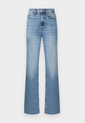 Jean flare bleu clair à taille haute, avec une fermeture à bouton sur le devant, des coutures visibles et une texture légèrement délavée.