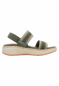 Green fabric sandal with two wide straps featuring orange and white stripes, a thick white and orange ridged sole, and a cushioned footbed.
