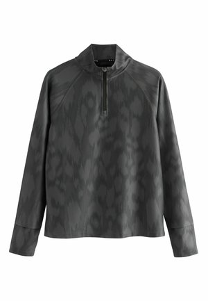 Gray pullover top with a high collar and half-zipper. Features a subtle textured pattern. Long sleeves with raglan seams. Smooth fabric finish.