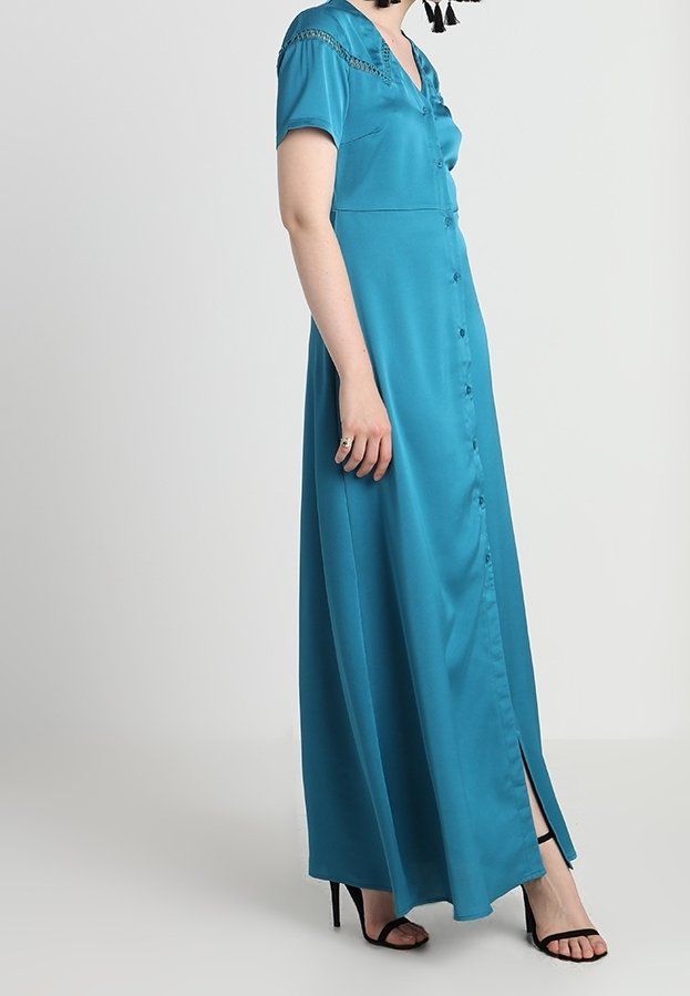 Turquoise satin maxi dress with short sleeves, button front, and side slit. Features lace detailing on shoulders and a smooth texture.
