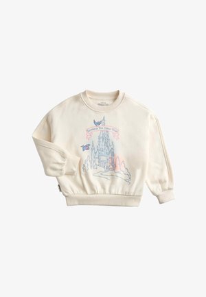 Felpa color crema per bambini con un castello delle fiabe, due uccellini blu e la frase "I sogni si avverano" sul davanti.