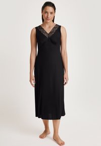 Rosa notte senza maniche nera con scollo a V in pizzo, tessuto morbido, design fluido e lunghezza fino al ginocchio, con un corpino aderente.