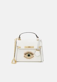 White leather handbag with gold hardware, featuring an eye design adorned with colorful beads and a detachable chain strap.