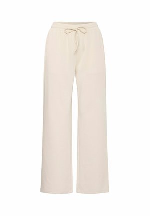 Pantalones de pierna ancha beige, hechos de tela suave, con cintura elástica y cordón. Presentan una textura suave y sin patrones visibles.