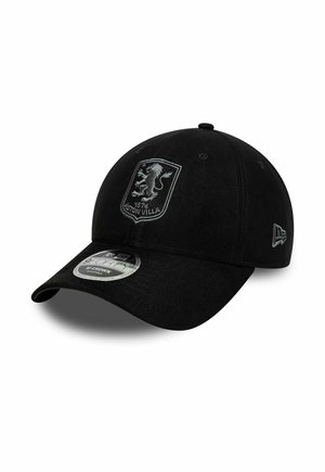Black baseball cap with Aston Villa logo featuring a lion and "1874 Aston Villa" text on the front, and a branded sticker on the brim.