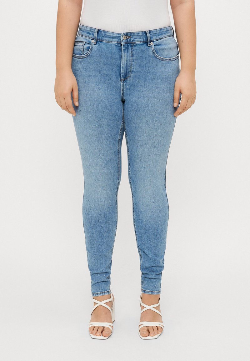 Light blue, fitted jeans with a classic five-pocket design, button and zipper closure, and slight stretch for comfort.