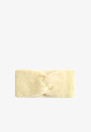 Cream-colored knitted headband with a soft, fuzzy texture and a twisted knot detail at the front. Measures approximately 5 inches wide.