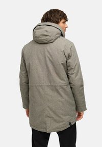 Gray insulated parka with a textured finish, adjustable hood, and a mid-length cut, featuring a vented back and black accent detail.