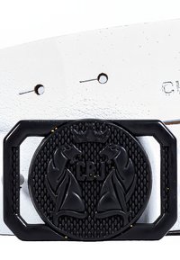 White leather belt featuring a black circular buckle with raised horse motifs and the letters "CBJ" embossed, set against a textured background.