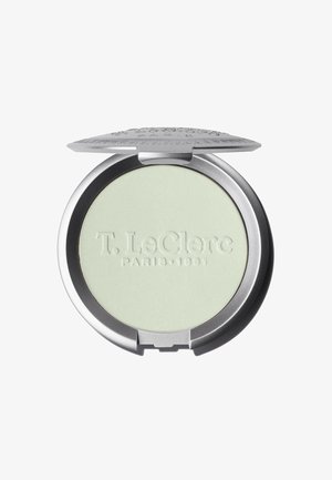 Cipria compatta in un elegante astuccio rotondo argentato, con una superficie opaca verde chiaro e il nome del marchio in rilievo. Il coperchio si apre orizzontalmente.