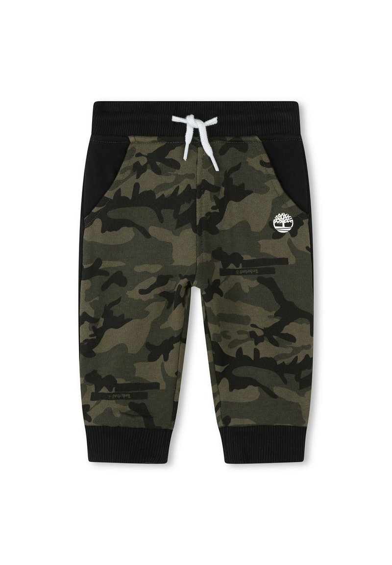 Pantalon de survêtement camouflage en vert et noir avec une taille à tirage, des poches latérales, des poignets côtelés et une petite impression de logo. Texture de tissu douce.