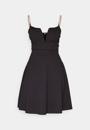 Black A-line dress with a deep V-neck and spaghetti strap design. Features pearl accents on the straps and a fitted bodice.