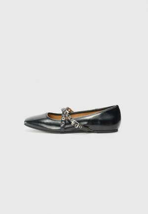 Black ballet flat with pointed toe and decorative crossed straps featuring silver eyelets, set against a plain white background.