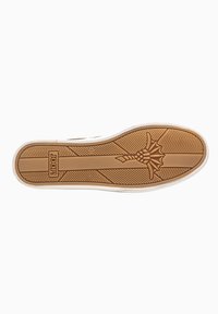 Rubber shoe sole with a textured brown surface, featuring a floral pattern near the heel and linear grooves for grip; white foam edges.