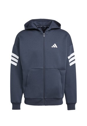 Sudadera con cremallera azul marino hecha de tela suave, con bolsillo delantero, puños acanalados y tres rayas blancas en las mangas. Logo de Adidas presente.