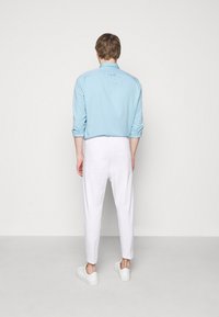 DRYKORN CHASY - Chinos - white