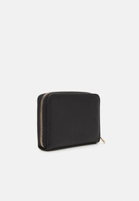 Black textured wallet with a gold zipper. Slim rectangular design, featuring a smooth surface and rounded corners.