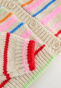 Knit cardigan in cream featuring vibrant stripes in orange, pink, blue, and red. Finishing details include light buttons and green accents.