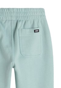 Ljusblå sweatpants med elastiskt midjeband, med en lagficka bak och en "VANS" logotag. Mjukt strukturerad tyg.
