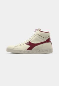 High-top sneaker, cream leather with burgundy accents, textured sides, lace-up closure, and rubber sole. Features logo on the side.