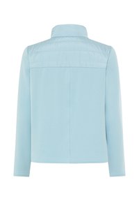 Light blue jacket featuring long sleeves, a high collar, and a quilted upper section. Smooth fabric with a clean, simple back design.