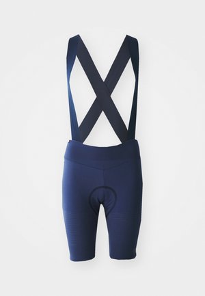 Navy cycling bib shorts with crossed straps, breathable fabric, padded seat area, and textured detailing along the legs.