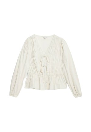 Blouse à manches longues couleur crème avec un décolleté en V profond, texture smockée, ceinture à la taille et basque. Fabriquée en tissu léger.