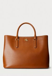 Brown leather tote bag with two handles, featuring a gold logo accent on the front, smooth texture, structured shape, and open top.