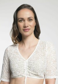 Weißes Spitzen-Crop-Top mit V-Ausschnitt, kurzen Ärmeln und einem Kordelzug-Detail an der Vorderseite. Verfügt über ein strukturiertes Blumenmuster.