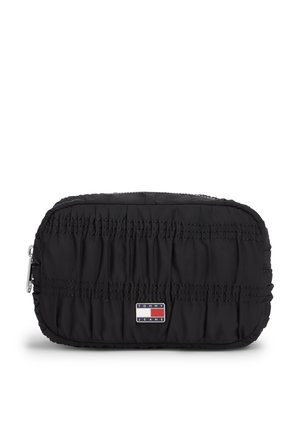 Piccola pochette nera rettangolare trapuntata con cerniera e toppa con logo Tommy Jeans centrata sul davanti.