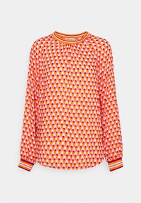 Pitkähihaista paitaa kirkkaan oranssina, jossa on geometrinen kuvio pinkeistä ja valkoisista ympyröistä. Korostettu raidallisilla hihoilla ja pyöreällä pääntiellä.