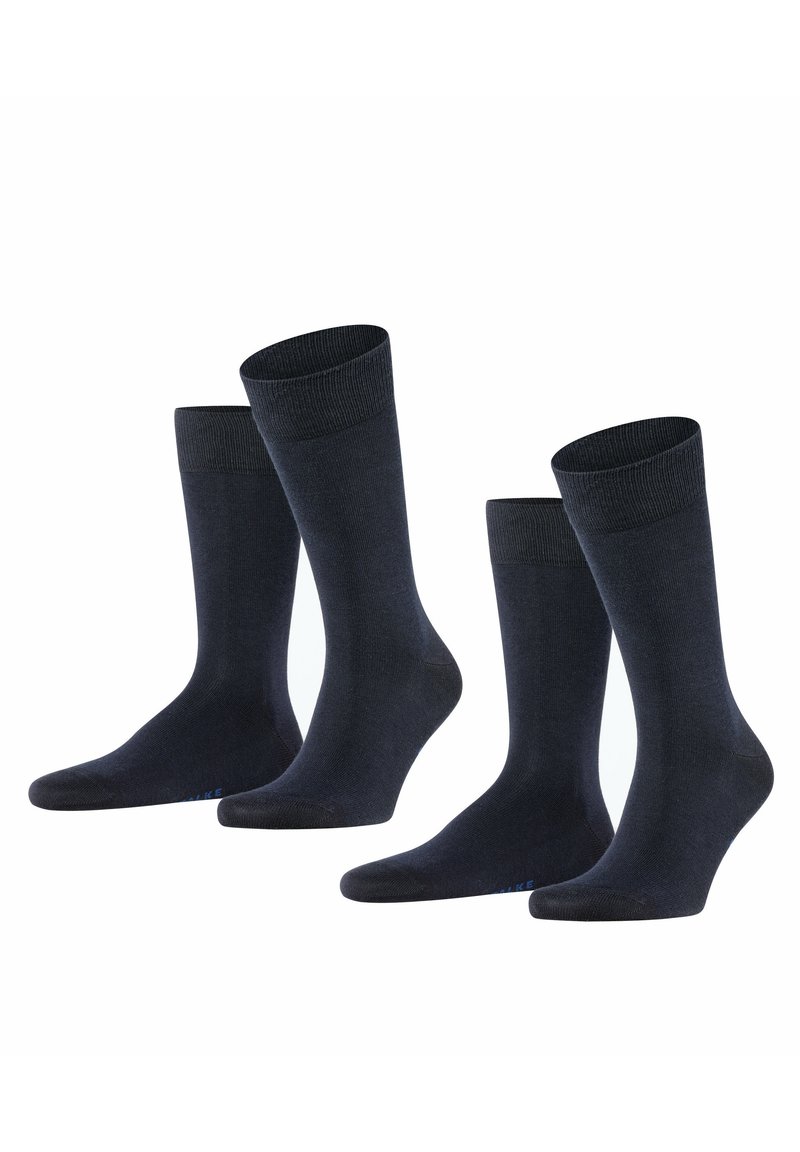 Calze di cotone blu scuro, con un bordo a coste, una texture liscia e una punta rinforzata, disposte in un gruppo di quattro paia.