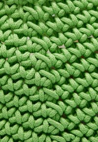 Green braided textile with a textured appearance, featuring tightly woven strands that create a soft, durable surface.