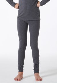 Grå leggings lavet af blødt, strækbart stof. Slim fit design med en glat overflade og ingen synlige sømme. Lav talje, ankellængde.