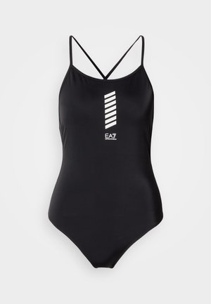 Maillot de bain une pièce noir avec un design dos nageur. Il présente des rayures verticales blanches et un logo au centre. Texture lisse.