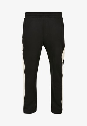 Pantalones deportivos negros de tela suave, con bolsillos laterales y una franja blanca contrastante a lo largo de las costuras exteriores. Cintura elástica incluida.