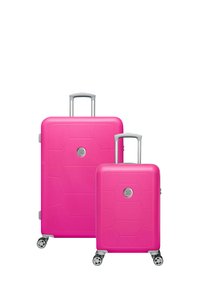 Pink hard-shell suitcase set with hexagonal pattern, silver accents, telescopic handles, and four wheels for mobility.