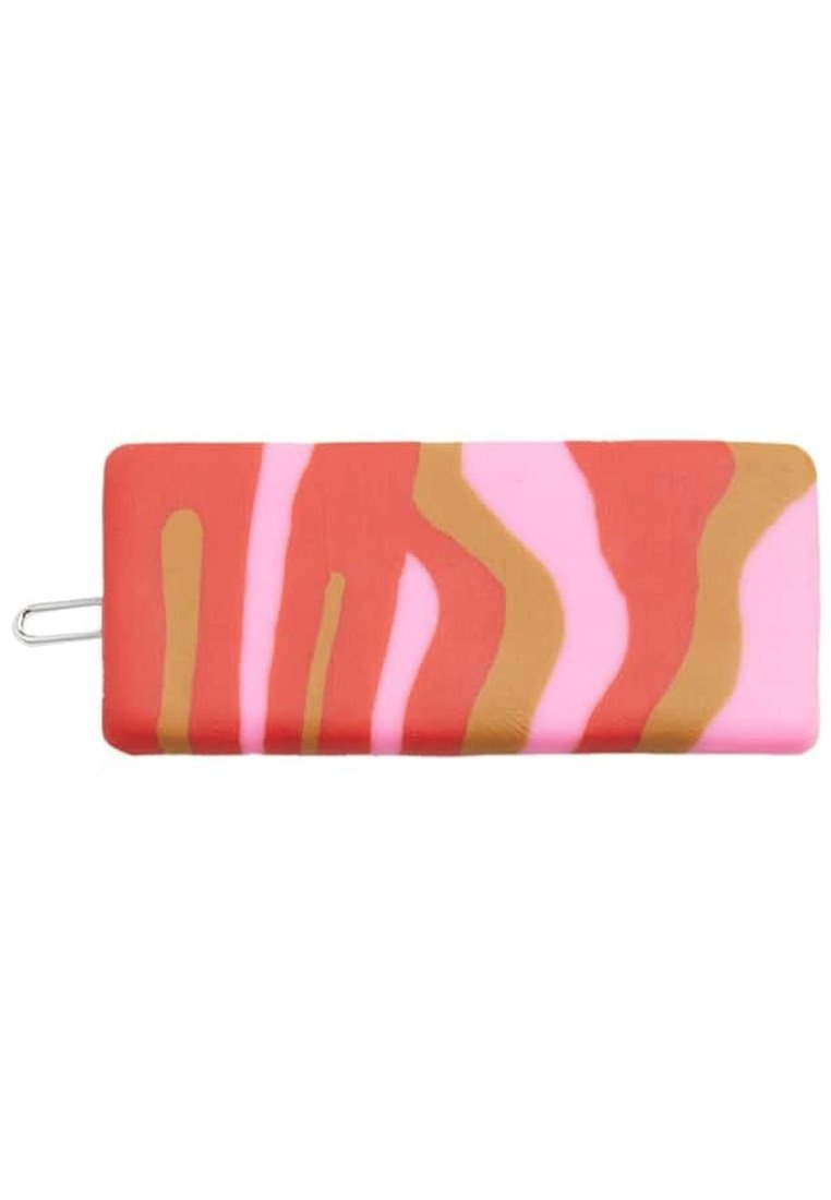 Colorful, rectangular silicone hair clip with swirling patterns in red, pink, and gold, featuring a metal loop on one end for securing.