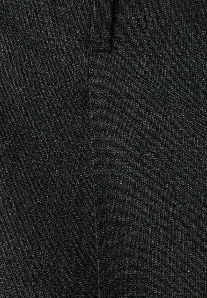 Black tailored trousers with a subtle check pattern. Made of textured fabric featuring straight lines and a smooth finish.