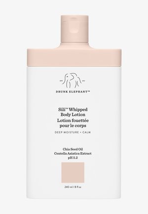 White bottle of Sili™ Whipped Body Lotion by Drunk Elephant, featuring a tan cap, product details, and ingredients on the label.