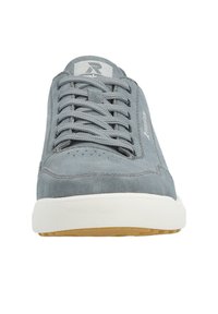 Light gray suede sneaker featuring a white rubber sole, round toe design, and six gray eyelets for laces. Subtle branding on the side.